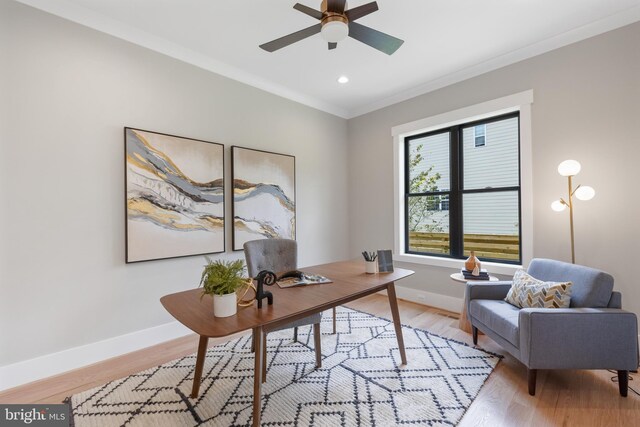 home office featuring ornamental molding, light hardwood / wood-style floors, and ceiling fan