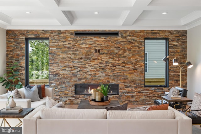 living room featuring coffered ceiling and beamed ceiling