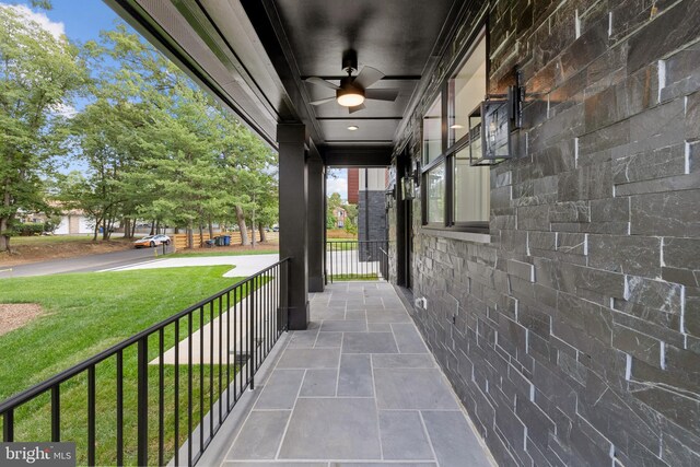 rear view of property with central AC, a deck, and a yard