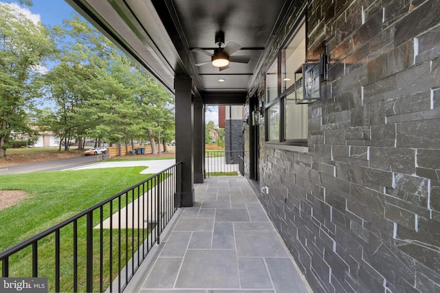 view of patio featuring a porch and a ceiling fan