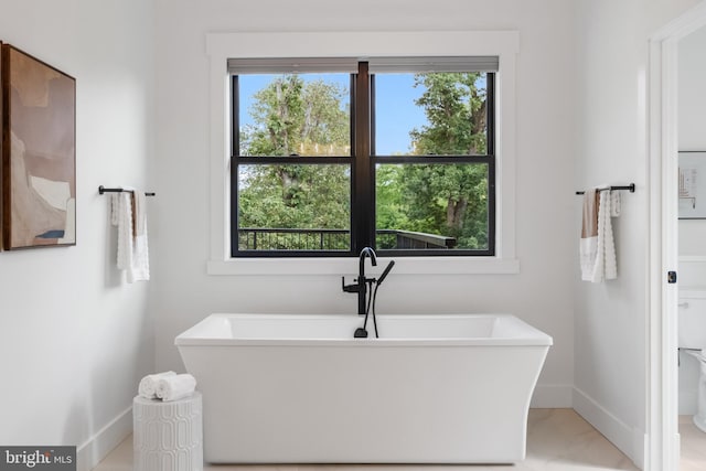 bathroom featuring a tub to relax in