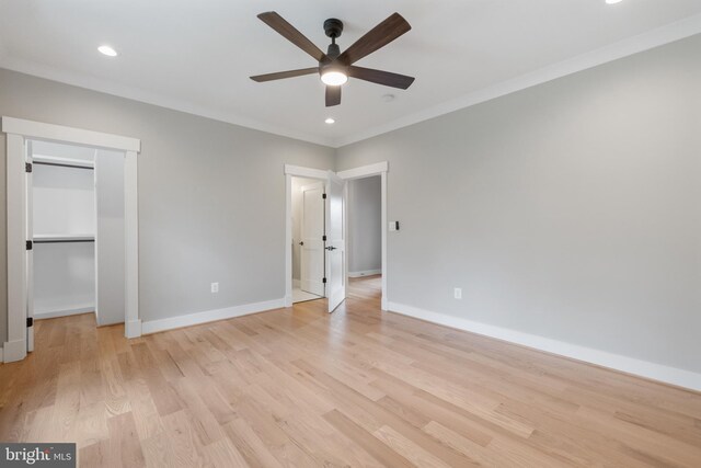 unfurnished bedroom with light hardwood / wood-style flooring, ceiling fan, and ornamental molding