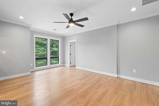 unfurnished room featuring light wood-type flooring, ceiling fan, and crown molding