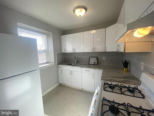 kitchen featuring white cabinets, white appliances, light tile patterned flooring, exhaust hood, and tasteful backsplash