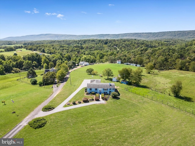 birds eye view of property featuring a mountain view and a rural view