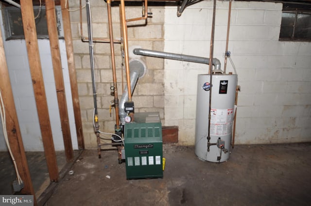 utility room featuring water heater