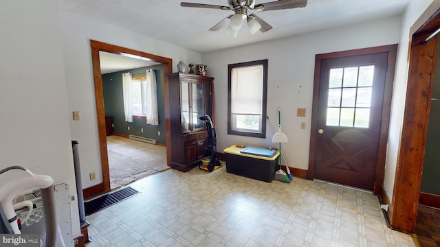 foyer with visible vents, light floors, baseboards, and a baseboard radiator