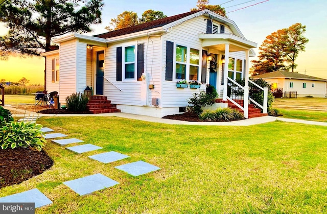 view of front of home with a lawn