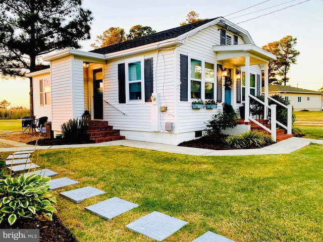 view of front of house with a yard