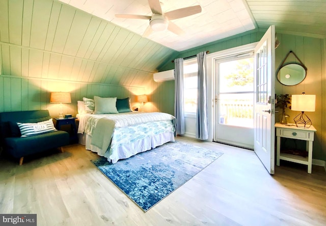 bedroom featuring wooden ceiling, lofted ceiling, an AC wall unit, ceiling fan, and light hardwood / wood-style floors