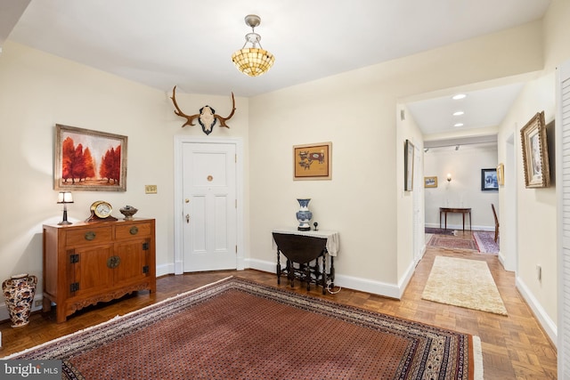 foyer with parquet flooring