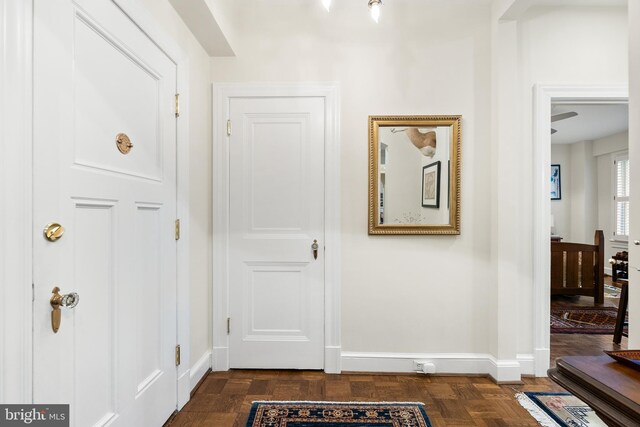 corridor featuring dark wood-type flooring