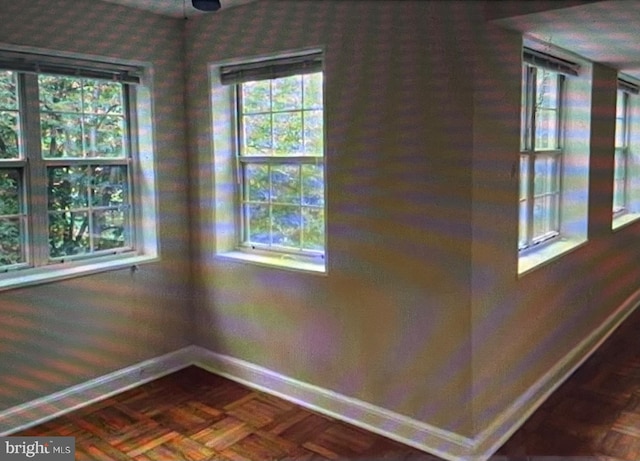 interior space with a wealth of natural light and parquet floors