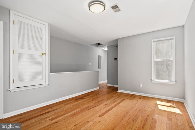 spare room with light wood-type flooring