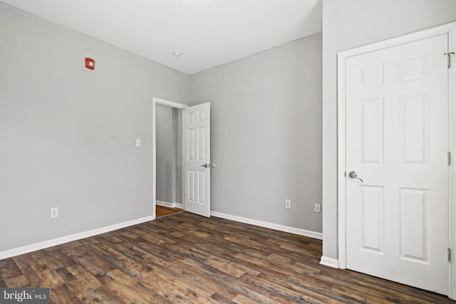 interior space with dark hardwood / wood-style flooring