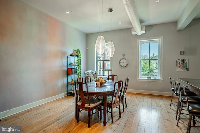 dining room featuring recessed lighting, baseboards, and light wood finished floors