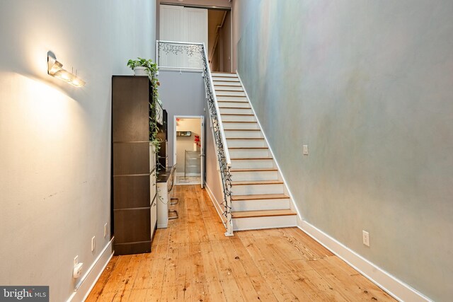 staircase featuring hardwood / wood-style flooring