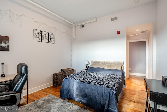 bedroom featuring wood-type flooring