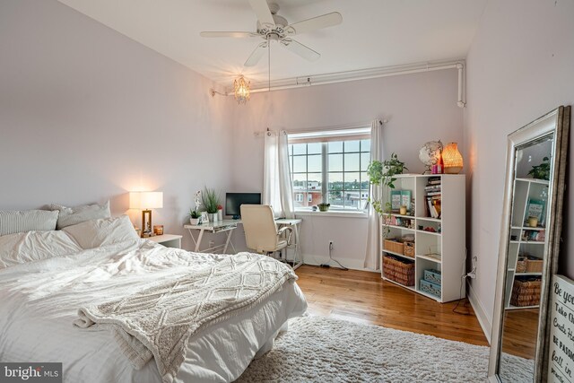 bedroom featuring ceiling fan and light hardwood / wood-style floors