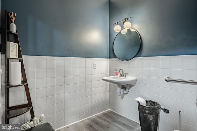 bathroom featuring tile walls, sink, and wood-type flooring