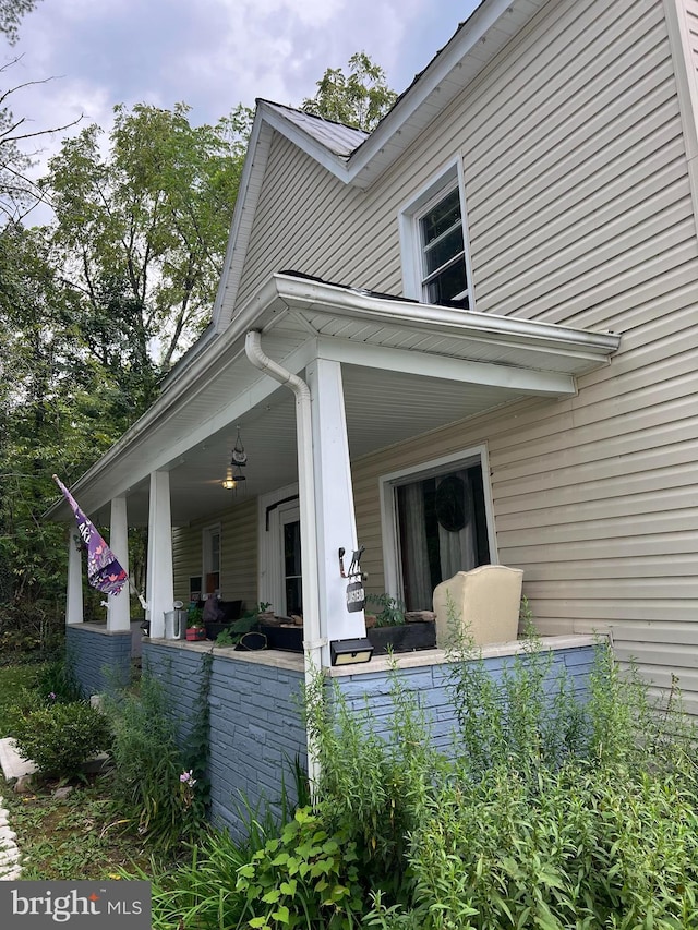 view of side of property featuring a porch