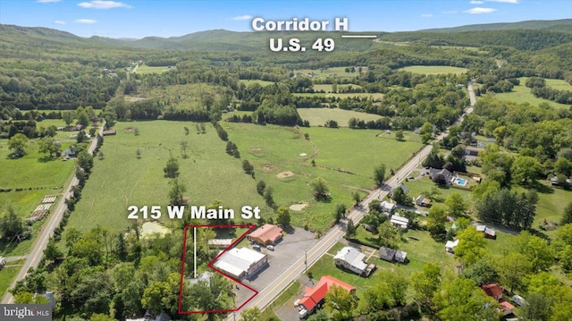 birds eye view of property featuring a mountain view