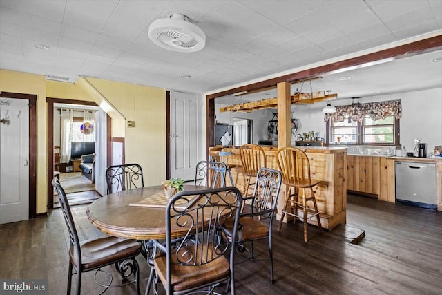 dining area featuring dark hardwood / wood-style floors