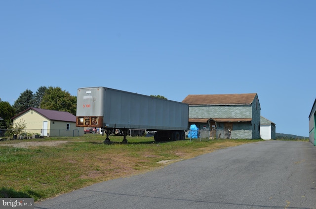 exterior space with a yard and a garage