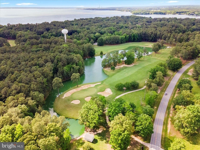 bird's eye view featuring view of golf course, a water view, and a wooded view