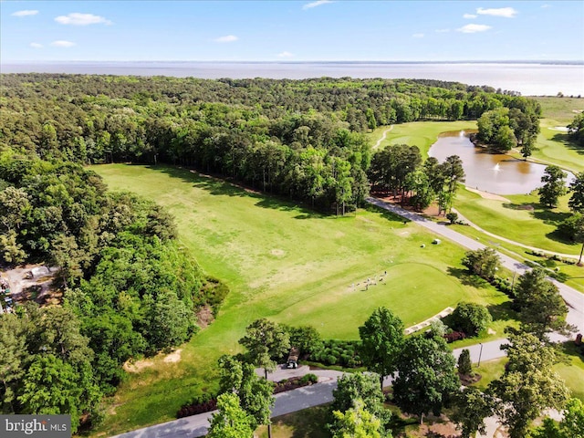 aerial view featuring a forest view, a water view, and golf course view