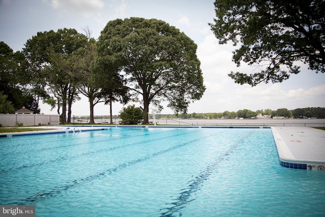 community pool featuring fence