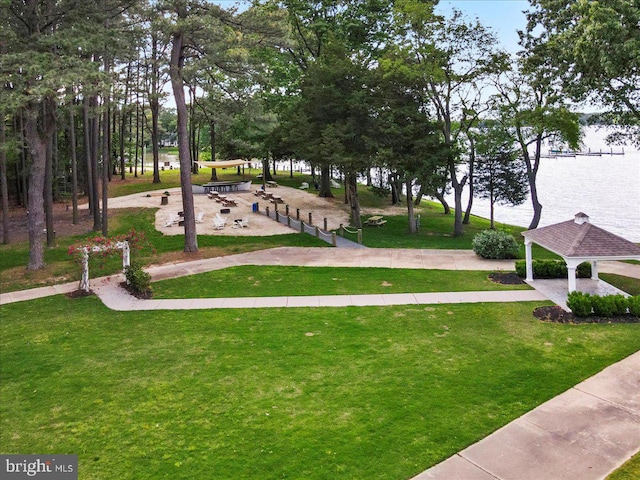 surrounding community featuring a water view, a yard, and a gazebo