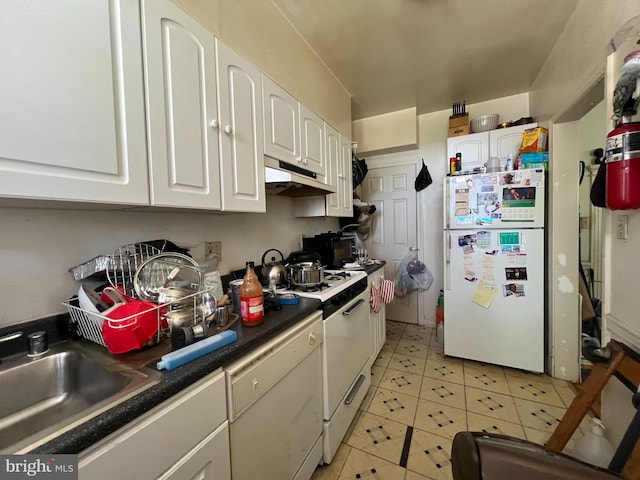 kitchen featuring white appliances, white cabinetry, and sink