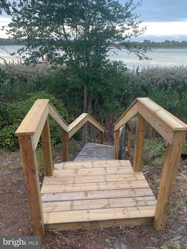 wooden deck with a water view