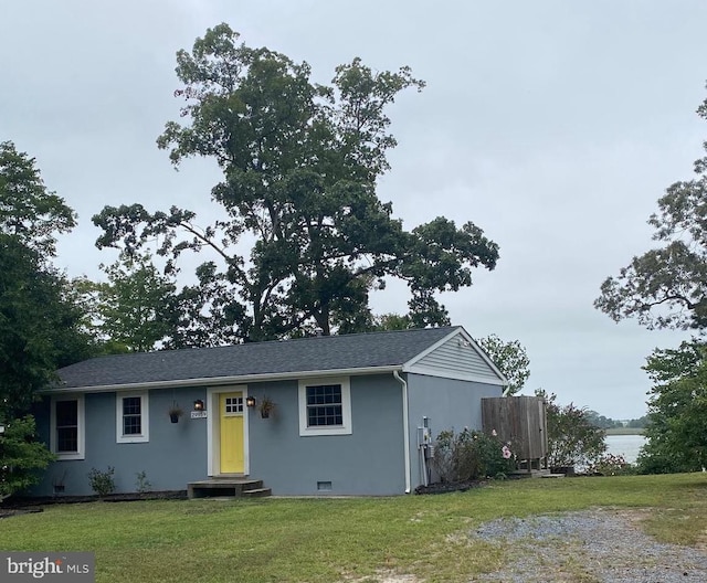 single story home featuring a water view and a front yard