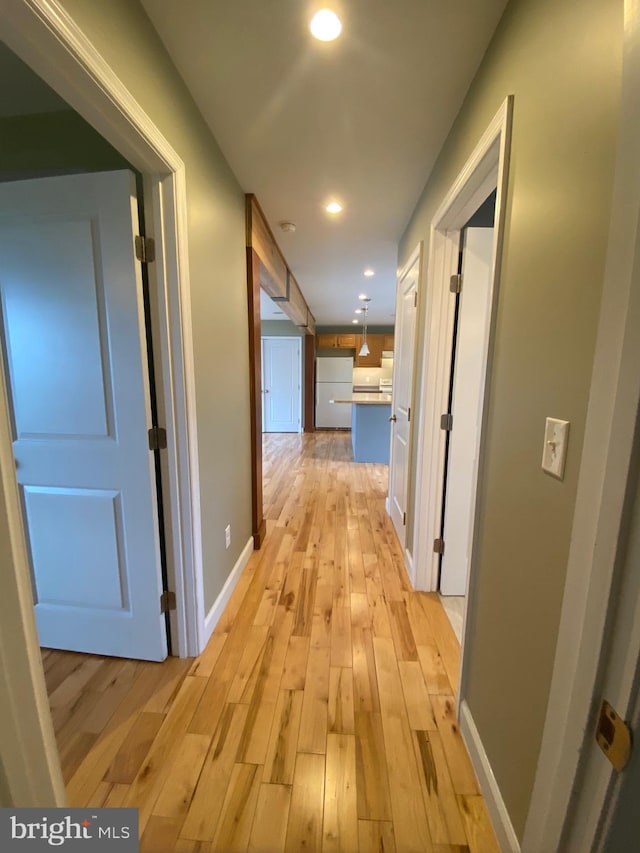 hall featuring light hardwood / wood-style flooring