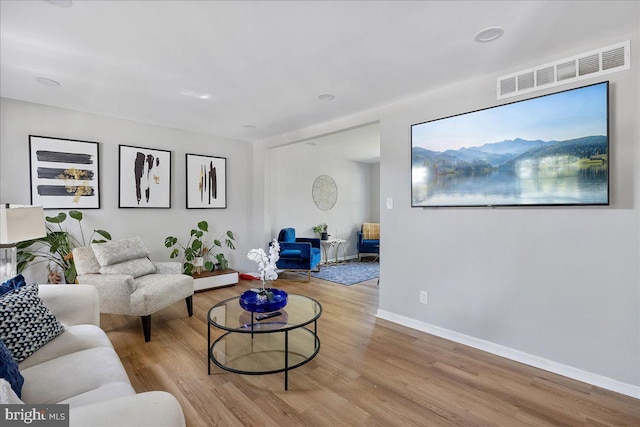 living room with light hardwood / wood-style floors