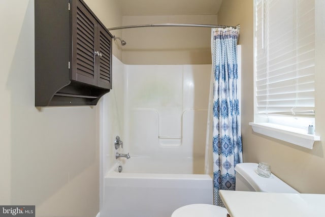 full bathroom featuring vanity, toilet, and shower / bath combination with curtain