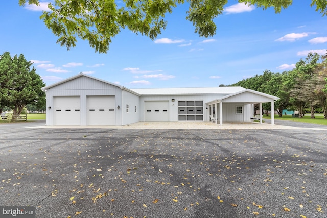 single story home featuring a garage and a carport