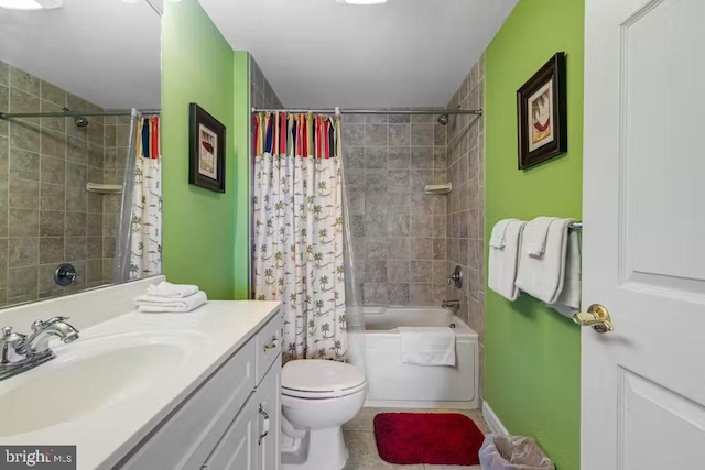 full bathroom featuring toilet, shower / tub combo with curtain, vanity, and tile patterned floors