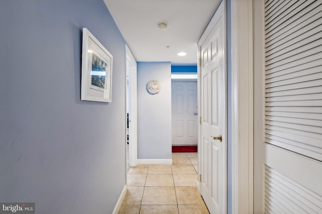 hallway featuring light tile patterned flooring