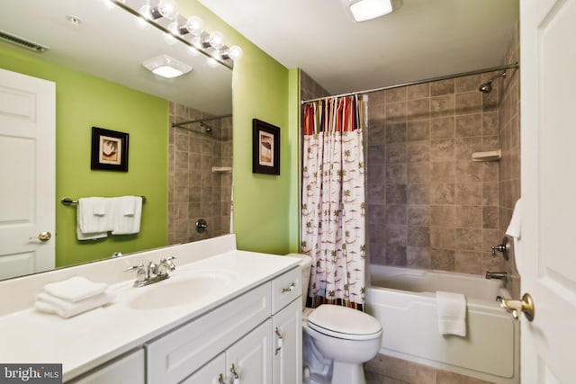 full bathroom featuring toilet, shower / tub combo, vanity, and tile patterned floors