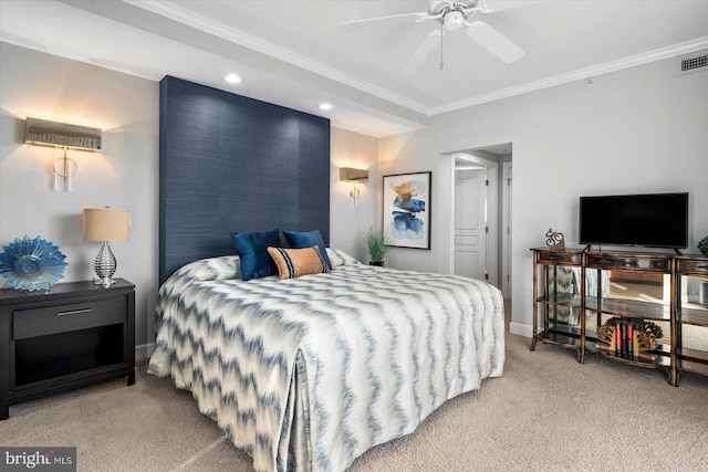 carpeted bedroom featuring crown molding and ceiling fan