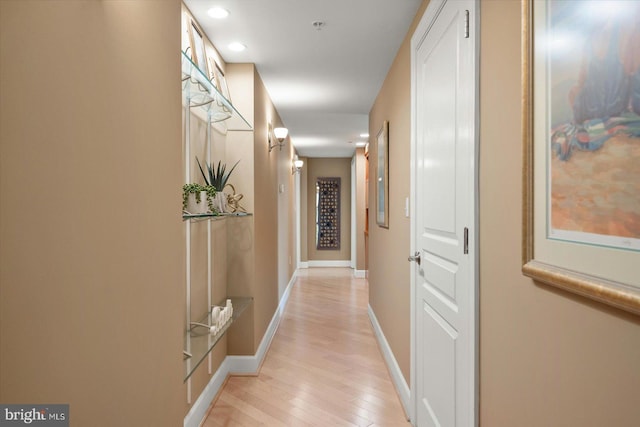 hall with light hardwood / wood-style floors