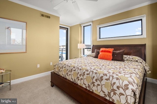 carpeted bedroom featuring crown molding and ceiling fan