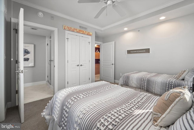 tiled bedroom with crown molding, ceiling fan, and a closet