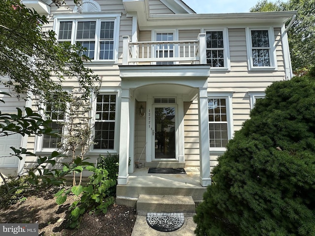 entrance to property with a balcony