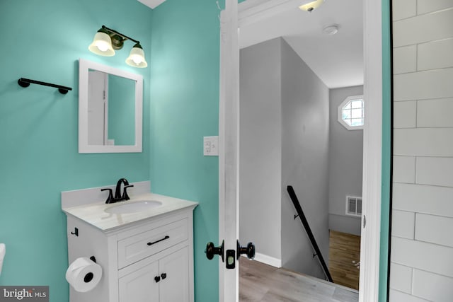 bathroom featuring wood-type flooring and vanity