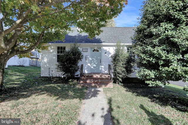 view of front of home with a front lawn