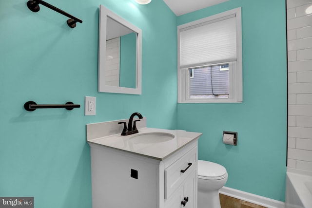 bathroom featuring hardwood / wood-style floors, vanity, and toilet